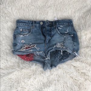 RIPPED BLUE JEAN SHORTS W/ BLUE AND RED BANDANA